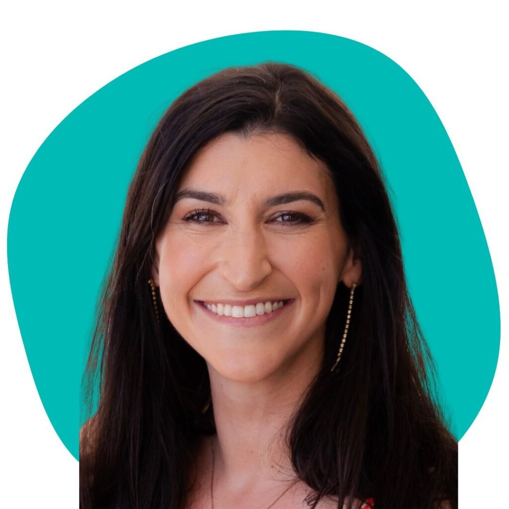 woman with dark brown hair in front of a green circle.